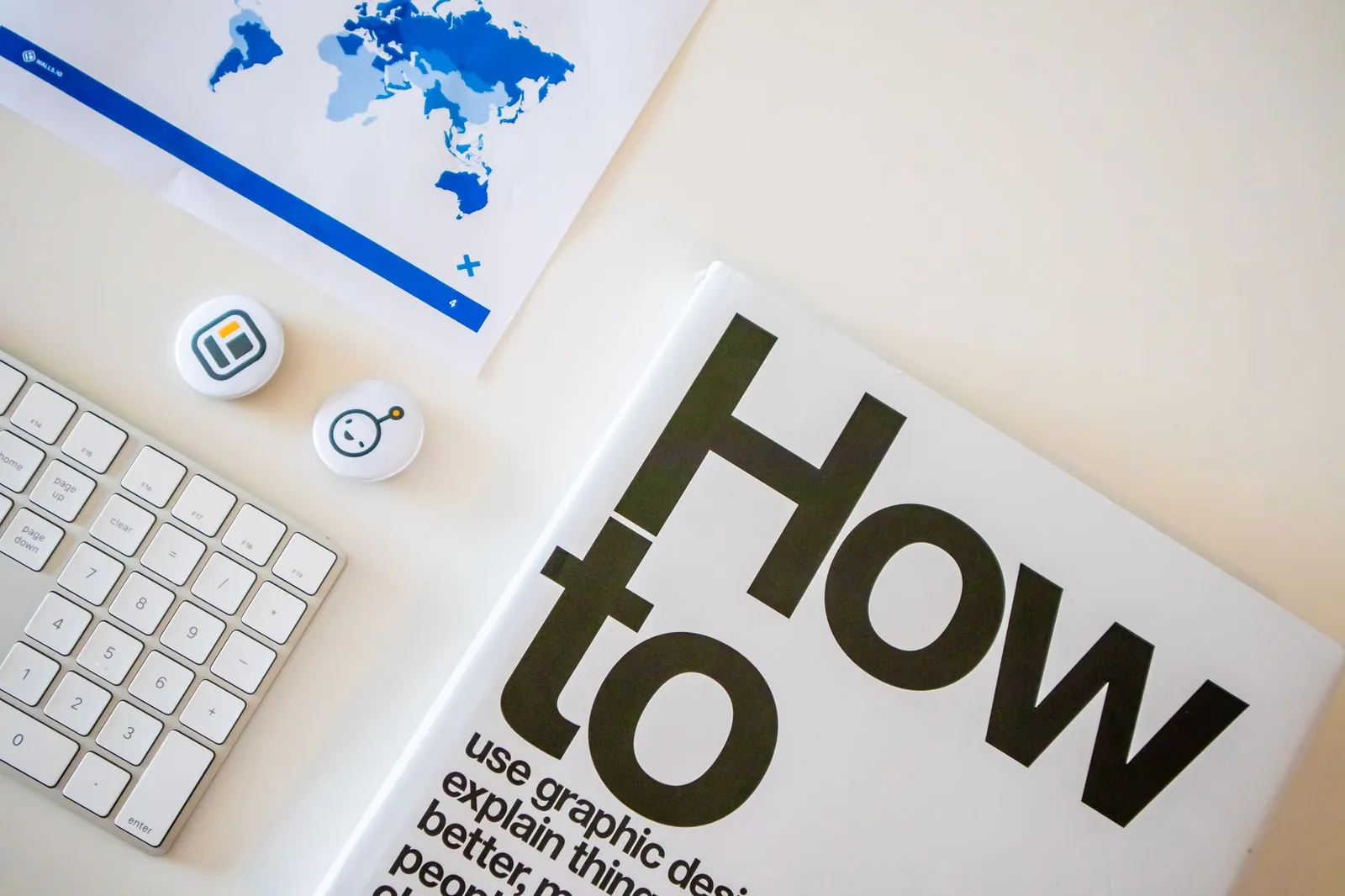 Hands holding a tablet showing software comparison charts on a clean white desk.
